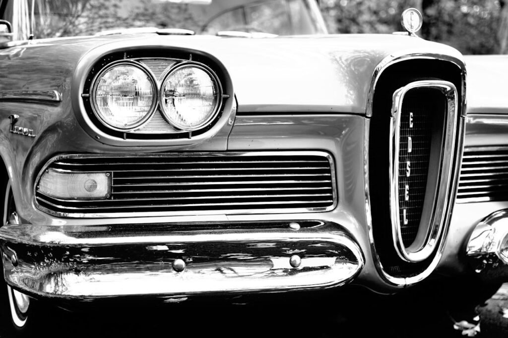 Close-up of a vintage Edsel car front showcasing its design in black and white.